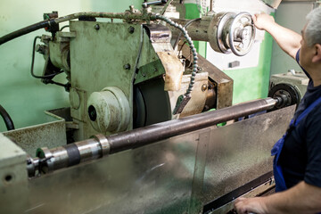 Professional works, the milling process for metal parts, metal machinery in large industrial plants-image