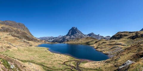Pic du Midi d'Ossau mountain and Lac Gentau mountain lake in Ossau Valley, iconic symbol of the French Pyrenees, Pyrenees National Park