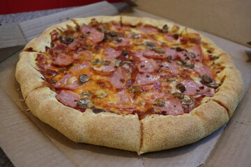 huge pizza with vegetables and mushrooms view