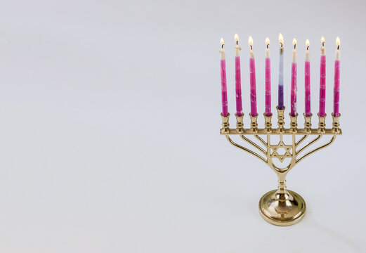 Traditional symbol hebrew Menorah of Hanukkah with burning candles is for Jewish holiday on white isolate background