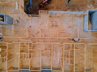 Aerial view of unfinished framing beam of new apartments under construction home residential building development