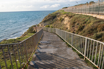 Fototapeta na wymiar stairs leading to the sea against the sky