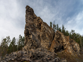 The Rock Golubka, which is not far from Krasnoyarsk, from a different angle does not resemble a bird, but it is clear that the years and tourists do not spare it.