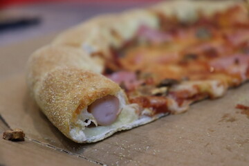 unique hot dog pipe in tasty pizza