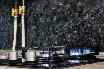 household cooktop with gas burners on