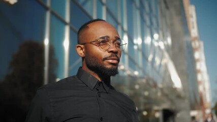 Confident young black businessman entrepreneur, smiling positive african american guy startup owner posing close up business portrait