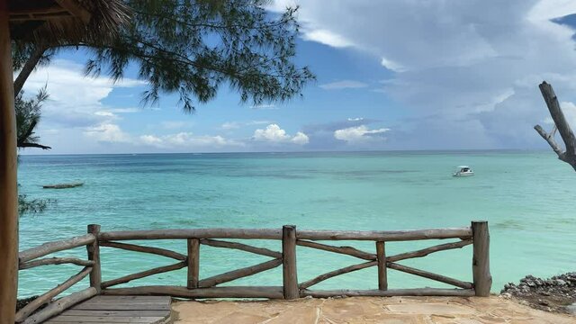 Patio view of the ocean in luxury resort, Zanzibar, slow motion track forward