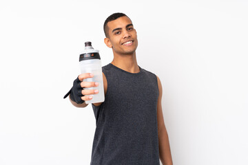 Young African American sport man over isolated white background with sports water bottle