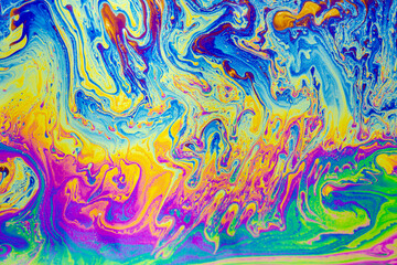 Psychedelic multicolored patterns background. Photo macro shot of soap bubbles