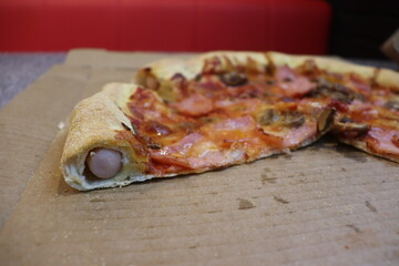 hot dog pipes inside tasty pizza
