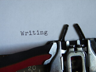 the word "writing" typed on a typewriter, close up