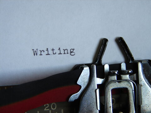 the word "writing" typed on a typewriter, close up
