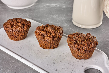 Carrot vegan muffins on gray stone table. Kinfolk style. Healthy breakfast.
