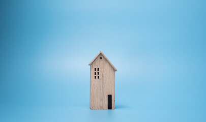Obraz na płótnie Canvas wooden house model on isolated background. real estate or property concept with copy space