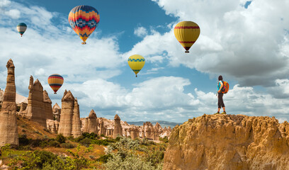 successful sporty woman in Cappadocia with hot air balloons Concept of motion motivation inspiration