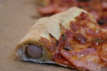 hot dog pipes inside tasty pizza