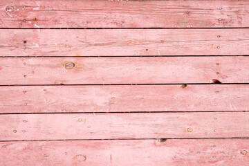 Naklejka premium Background from horizontally arranged pink boards, wood texture with copy space
