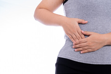 Woman hand touching stomach, waist, or liver position isolated white background. Health care and...