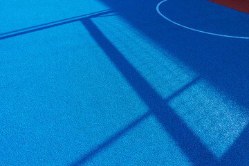 Colorful sports court background. Top view light blue field rubber ground with white line outdoors