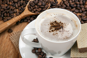 cup of coffee with whipped cream and cinnamon still life