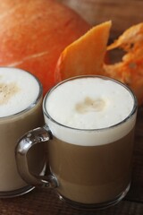 Pumpkin latte on a wooden table macro 