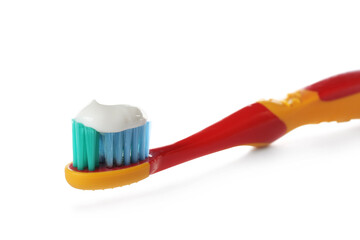 Toothbrush for children with paste isolated on white, closeup. Dental care