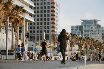 Skater rides along the  Tel Aviv seafront