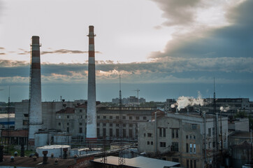 Urban landscape of a city and an old factory. Upper view