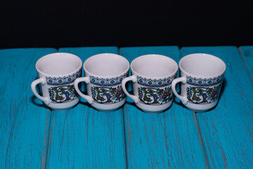 porcelain cup, Turkish coffee cup and blue color background
