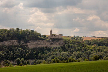 Fototapeta na wymiar Panorama of the castle ruins Rudelsburg and Saaleck in the landscape and tourist area Saale valley on the river Saale near the world cultural heritage city of Naumburg, Saxony Anhalt, Germany
