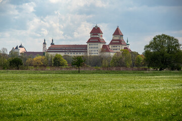 View of the meadows and fields with the historic buildings of the city of Wurzen im Muldental near...