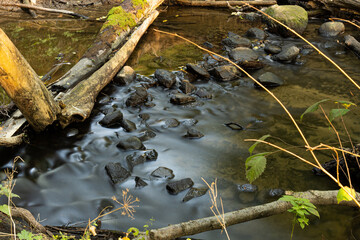 stones dam on the calm river