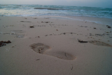 footprints in the sand cancun mexico summer vacation