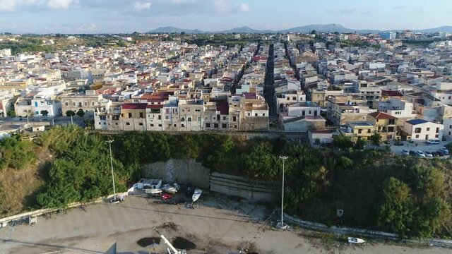 Aerial low altitude footage of Balestrate is a comune in Italian region Sicily located about 25 kilometres southwest of Palermo showing typical south european houses and buildings 4k high resolution