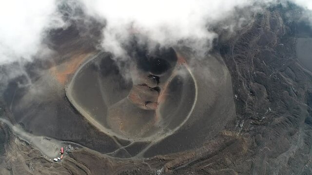 Aerial static view of Mount Etna Barbagallo crater which is part of an active stratovolcano on east coast of Sicily Italy and the summit of the mountain climb therefor a popular tourist destination 4k