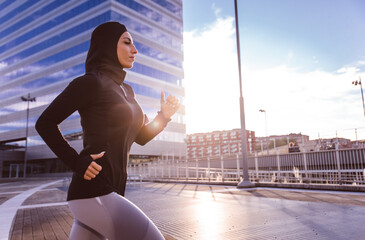 Muslim urban runner training in the city center