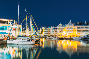 Benalmadena, Spain. Night Scenery View Of Floating Houses, Vessel In Puerto Marina. Malaga Region, On The Costa Del Sol. It Caters For A Large Number Of Tourists - obrazy, fototapety, plakaty
