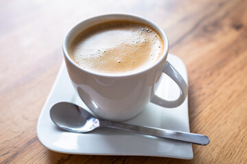 A cup of black coffee on the table