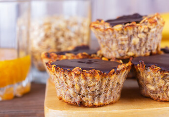 Vegan muffins. Oatmeal muffins with banana, tangerine jam and dark chocolate. Selective focus. Healthy sweets. Close up.