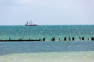 broken pilings pier in the ocean Key West