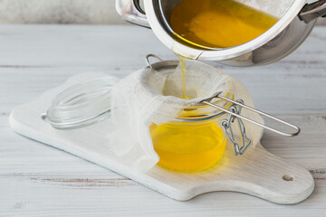 Preparation of Ghee or a clarified butter. Healthy fat diet concept