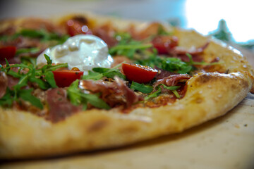 Tasty vegetarian pizza with cherry tomatoes, mozzarella cheese and fresh oregano