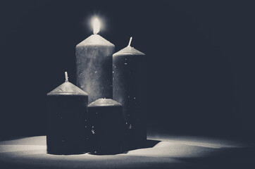 advent decoration with one burning candles