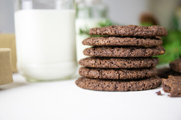 Chocolate Chip Cookies on a White Plate with Milk Bottles. Christmas concept