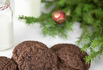 Chocolate Chip Cookies on a White Plate with Milk Bottles. Christmas concept