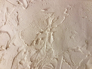 Textured plaster. Beige wall stucco texture. Plastered background