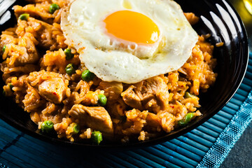 Spicy fried rice with chicken, kimchi and egg