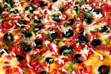 Pizza with salami and olives. Italian food background. Happiness is in small things. Close-up