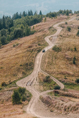 Zakhar Berkut, Ukraine - September 7, 2019: people riding on all terrain vehicle by mountains