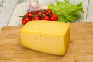 Hard yellow tasty cheese brick